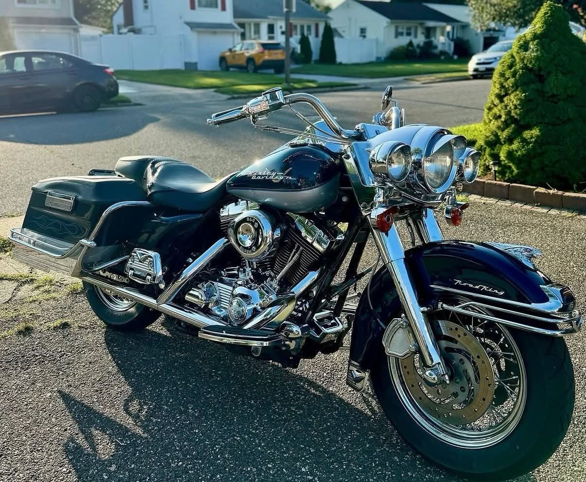 Blue touring motorcycle with polished chrome after detailing